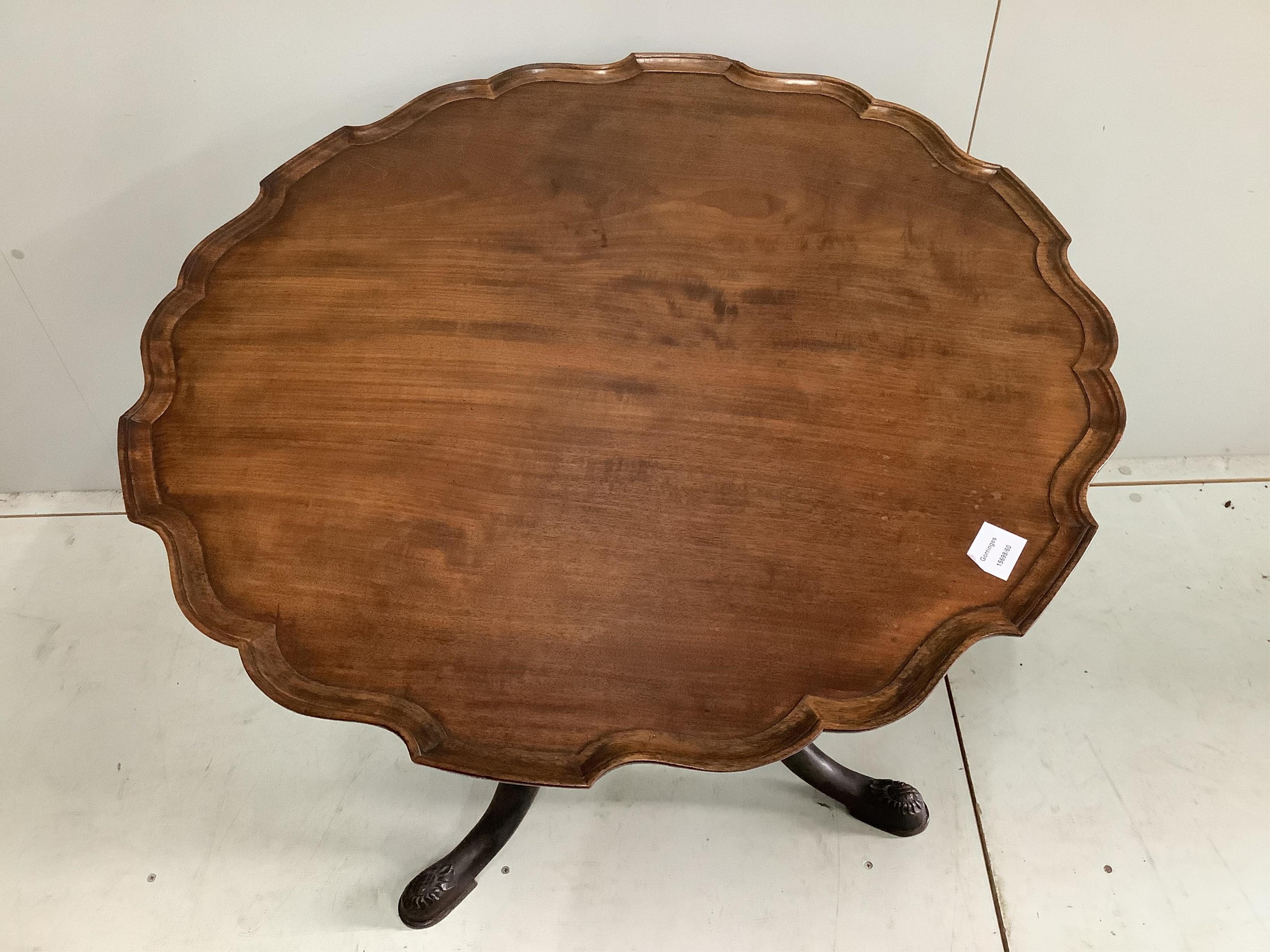 A George III mahogany bird cage tripod table with later piecrust top, diameter 82cm, height 72cm. Condition - top faded, otherwise fair to good